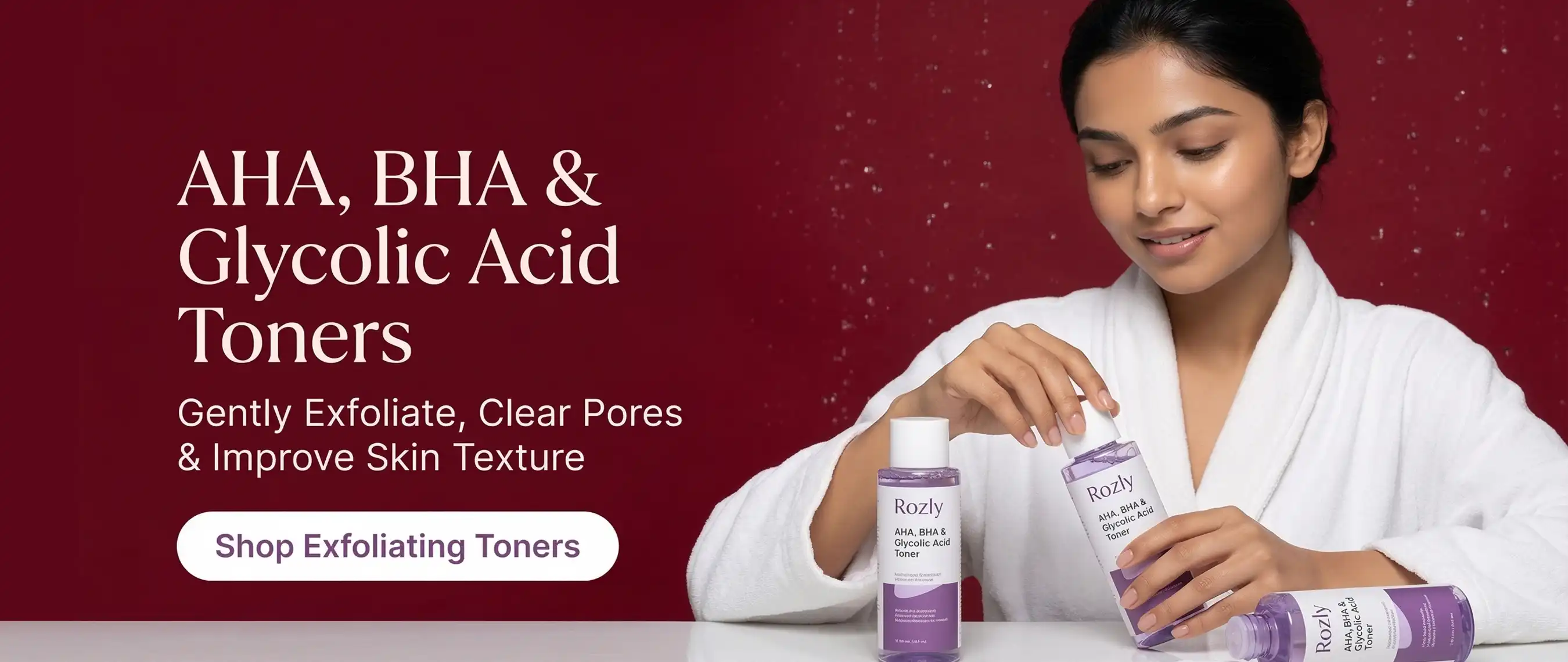 Model applying AHA BHA exfoliating toner for glowing skin against a luxury maroon background.