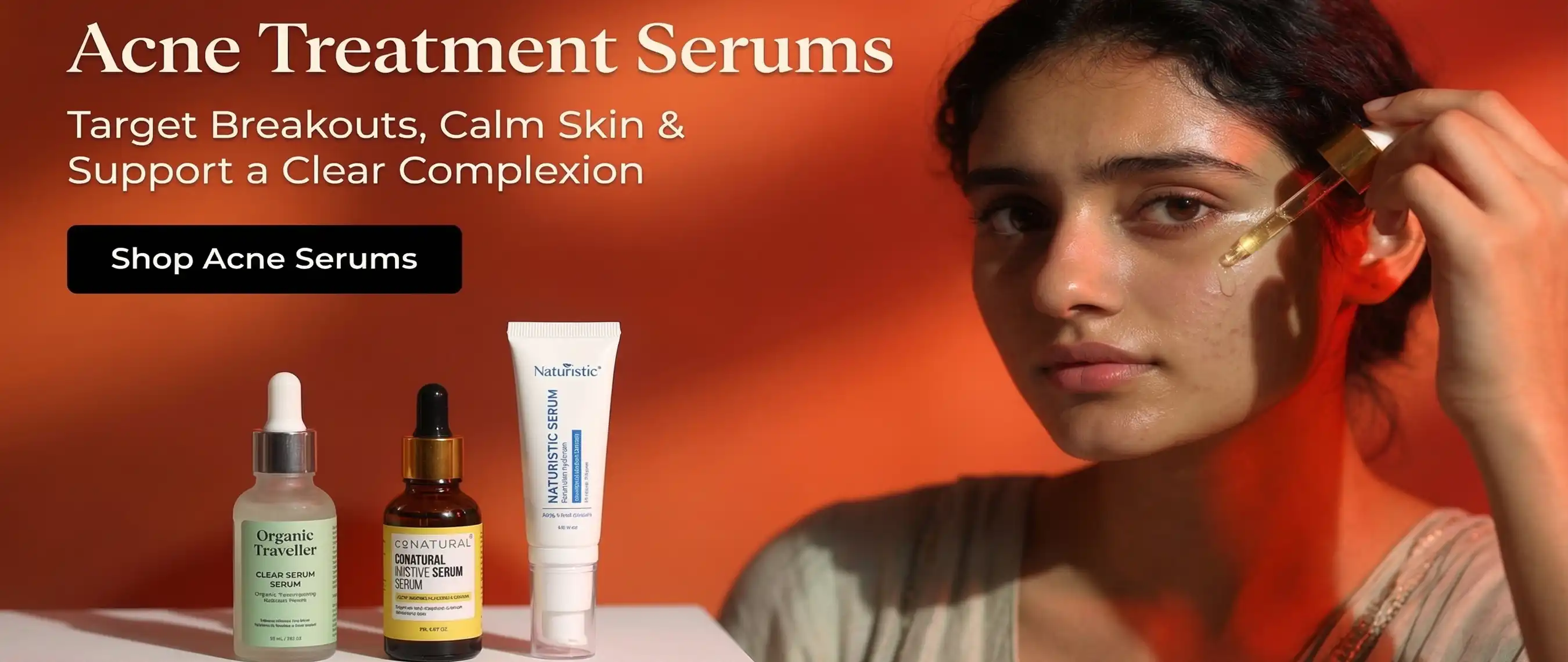 A girl applying Acne Treatment Serums on right cheek against a luxury orange cosmetics theme with luxury products at Rozly.